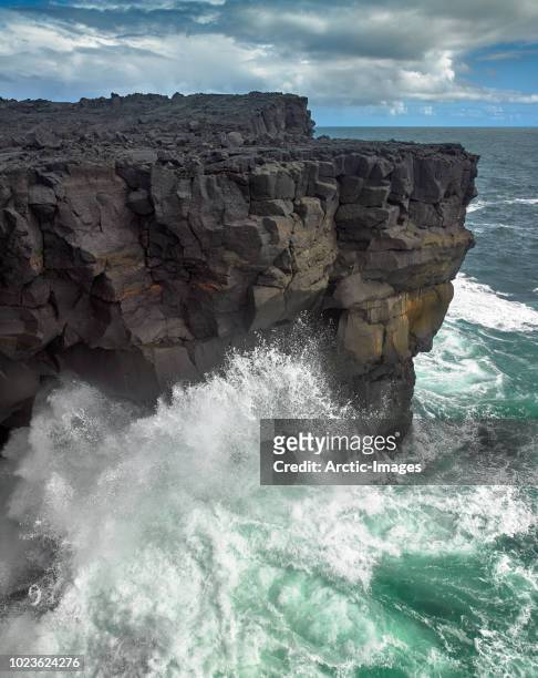 waves and cliffs, westman islands, iceland - roccia foto e immagini stock