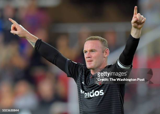Forward Wayne Rooney celebrates a 2nd half goal that he scored on a free kick during DC United's defeat of the Portland Timbers 4-1 in Washington, DC...