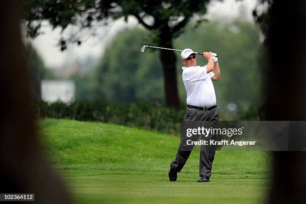 Peter O'Malley of Australia plays his approach shot on the seventh hole during the first round of the BMW International Open at the Munich North...