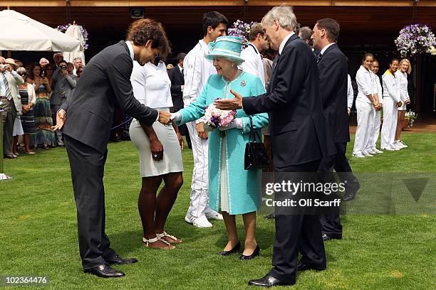Queen Elizabeth II meets Roger Federer, Serena Williams, Novak Djokovic, Andy Roddick, Venus Williams and Caroline Wozniacki as she attends the...