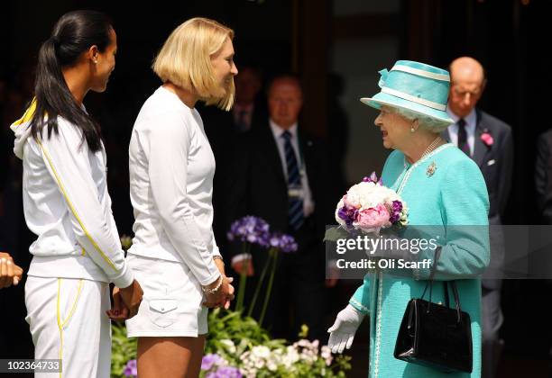 British tennis players Anne Keothavong and Elena Baltacha meet Queen Elizabeth II as she attends the Wimbledon Lawn Tennis Championships on Day 4 at...
