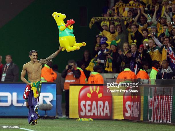 Tim Cahill of Australia waves a blow up kangaroo to the crowd after victory in the game but elimination from the tournament in the 2010 FIFA World...