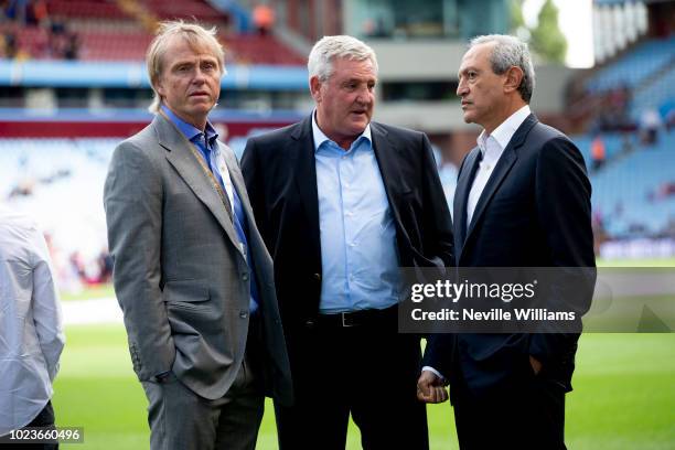 Steve Bruce manger of Aston Villa talks to Wes Edens and Nassef Sawiris before the Sky Bet Championship match between Aston Villa and Reading at...