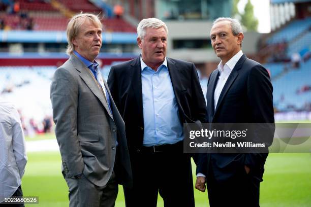 Steve Bruce manger of Aston Villa talks to Wes Edens and Nassef Sawiris before the Sky Bet Championship match between Aston Villa and Reading at...