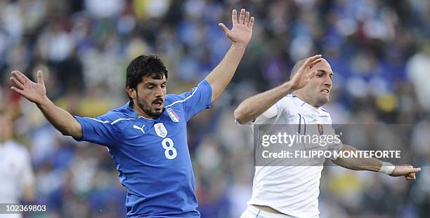 Slovakia's striker Robert Vittek clashes with Italy's midfielder Gennaro Gattuso during the Group F first round 2010 World Cup football match between...