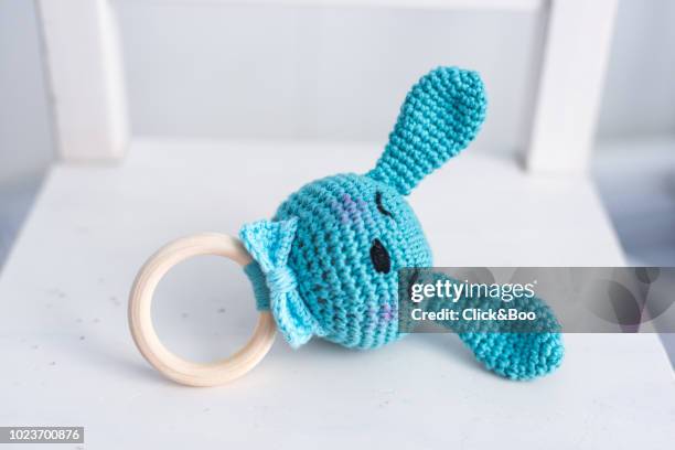 handmade crocheted rabbit rattle with a bow tie - pacifier stockfoto's en -beelden
