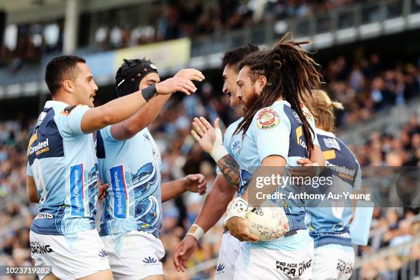 Rene Ranger of Northland celebrates with teammates after scoring a try during the round two Mitre 10 Cup match between Northland and Auckland at Toll...