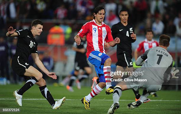 Roque Santa Cruz of Paraguay has a shot saved by Mark Paston of New Zealand during the 2010 FIFA World Cup South Africa Group F match between...