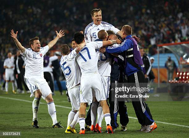 Slovakia players celebrate after Kamil Kopunek scored his team's third goal during the 2010 FIFA World Cup South Africa Group F match between...