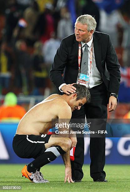 Ryan Nelsen of New Zealand is consoled by Ricki Herbert head coach of New Zealand after the 2010 FIFA World Cup South Africa Group F match between...