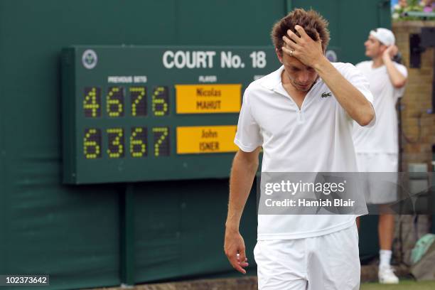 Nicolas Mahut of France after losing on the third day of his first round match against John Isner of USA on Day Four of the Wimbledon Lawn Tennis...