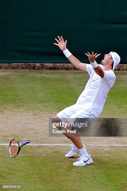 John Isner of USA celebrates winning on the third day of his first round match against Nicolas Mahut of France on Day Four of the Wimbledon Lawn...