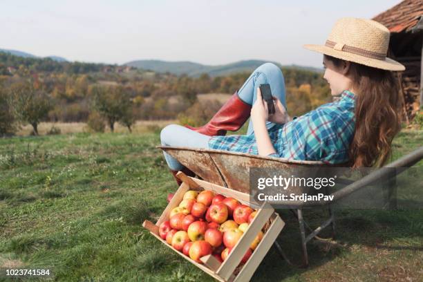 village goes mobile - wheelbarrow stock pictures, royalty-free photos & images