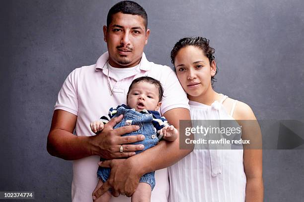 portrait of parents with their baby - baby studio shot stock pictures, royalty-free photos & images