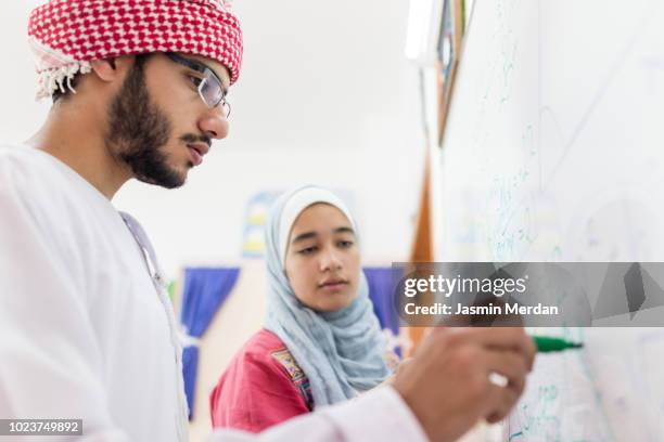 in middle eastern school - two young arabic children only indoor portrait stock-fotos und bilder