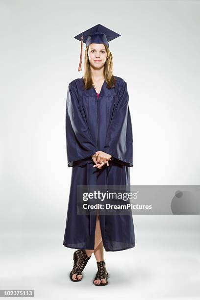 female high school graduate - graduation gown stock pictures, royalty-free photos & images