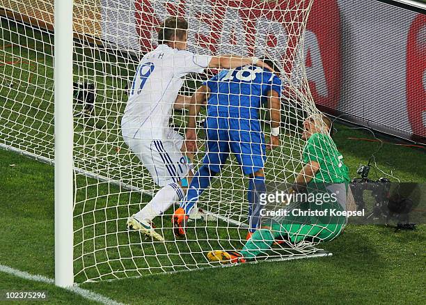 Juraj Kucka intervenes in a scuffle between Fabio Quagliarella of Italy and Jan Mucha of Slovakia following Italy's first goal, during the 2010 FIFA...