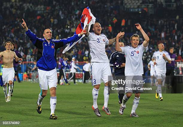 Robert Vittek, Martin Skrtel and Radoslav Zabavnik of Slovakia celebrate victory after knocking Italy out of the competition during the 2010 FIFA...