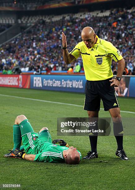 Referee Howard Webb urges Jan Mucha of Slovakia to get up during the 2010 FIFA World Cup South Africa Group F match between Slovakia and Italy at...
