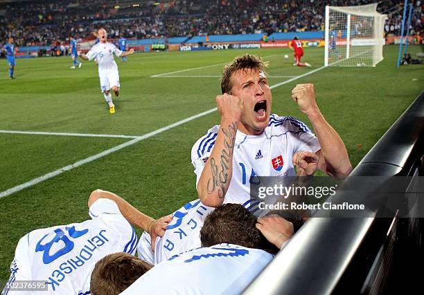 Slovakia players celebrate the second goal by Robert Vittek during the 2010 FIFA World Cup South Africa Group F match between Slovakia and Italy at...