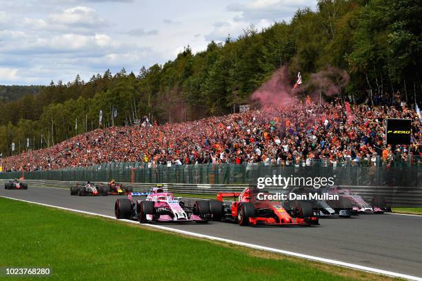 Esteban Ocon of France driving the Sahara Force India F1 Team VJM11 Mercedes, Sebastian Vettel of Germany driving the Scuderia Ferrari SF71H, Lewis...