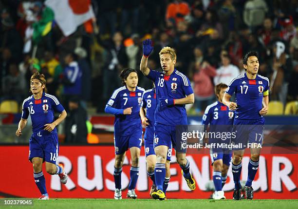 Keisuke Honda of Japan celebrates scoring during the 2010 FIFA World Cup South Africa Group E match between Denmark and Japan at the Royal Bafokeng...