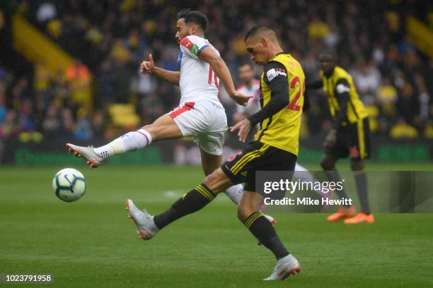 Jose Holebas of Watford challenges for the ball with Andros Townsend of Crystal Palace during the Premier League match between Watford FC and Crystal...