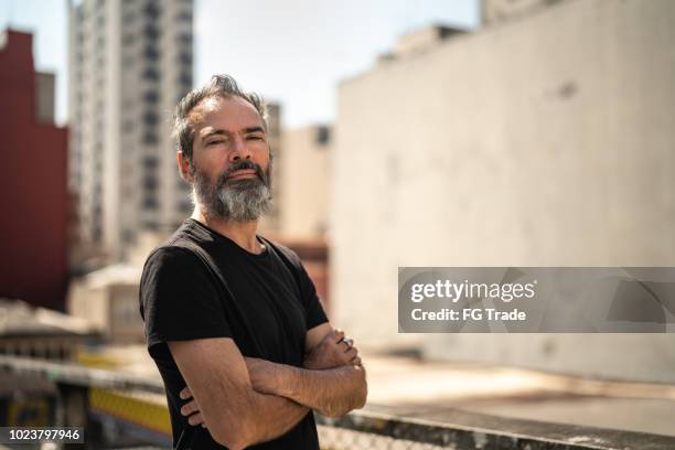 mature man portrait arms crossed - beard men street stock pictures, royalty-free photos & images