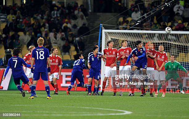 Yasuhito Endo of Japan scores his team's second goal from a free kick during the 2010 FIFA World Cup South Africa Group E match between Denmark and...