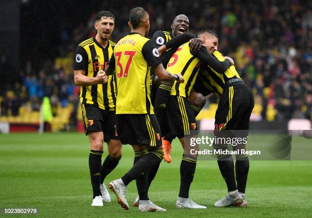 Jose Holebas of Watford celebrates with teammates after scoring his team's second goal during the Premier League match between Watford FC and Crystal...