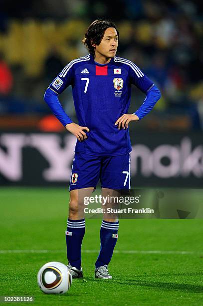 Yasuhito Endo of Japan prepares to take a free kick during the 2010 FIFA World Cup South Africa Group E match between Denmark and Japan at the Royal...