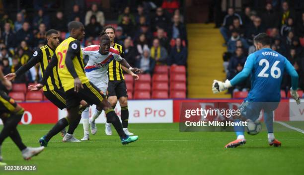 Wilfried Zaha of Crystal Palace scores his team's first goal during the Premier League match between Watford FC and Crystal Palace at Vicarage Road...