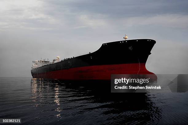 oil tanker at twilight - オイルタンカー ストックフォトと画像