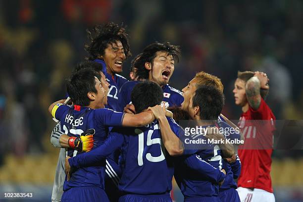 Japan players celebrate victory following the 2010 FIFA World Cup South Africa Group E match between Denmark and Japan at the Royal Bafokeng Stadium...