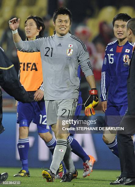 Japan's goalkeeper Eiji Kawashima celebrates with team mates at the end of the Group E first round 2010 World Cup football match Denmark vs. Japan on...