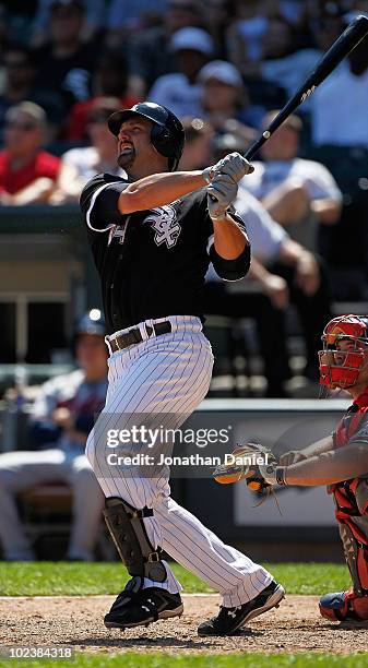 Paul Konerko of the Chicago White Sox hits the game winning home run, a two-run shot in the 8th inning, against the Atlanta Braves at U.S. Cellular...