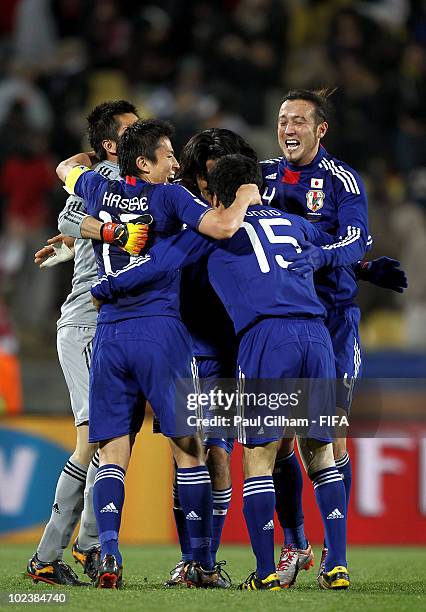 Makoto Hasebe , Yasuyuki Konno and Marcus Tulio Tanaka of Japan of Japan celebrate with teammates after the 2010 FIFA World Cup South Africa Group E...