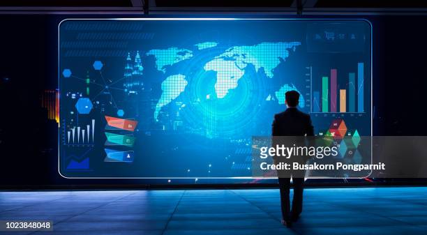 business man looking financial graph icon on futuristic virtual screen with technology - big data management 個照片及圖片檔