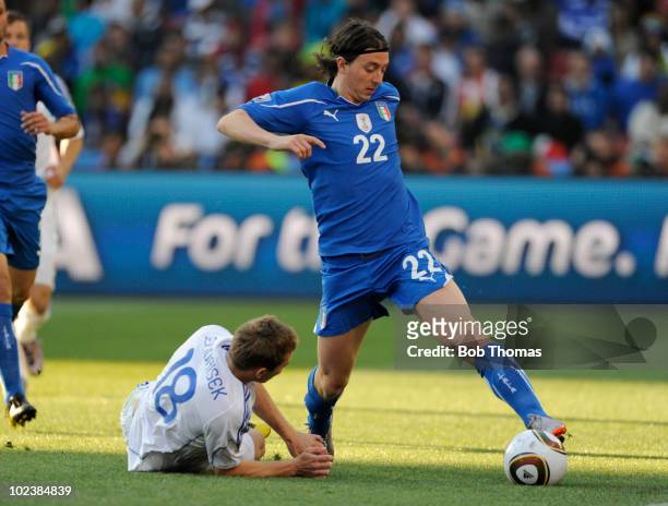 Riccardo Montolivo of Italy moves away from Erik Jendrisek of Slovakia during the 2010 FIFA World Cup South Africa Group F match between Slovakia and...