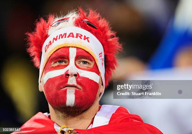 Denmark fan looks dejected after being defeated during the 2010 FIFA World Cup South Africa Group E match between Denmark and Japan at the Royal...