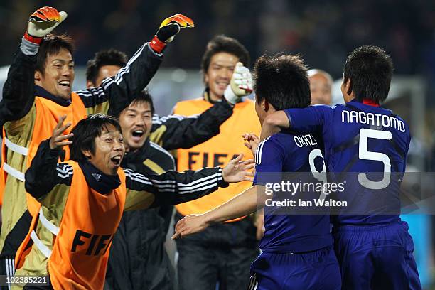 Shinji Okazaki of Japan celebrates scoring his team's third goal with team mates during the 2010 FIFA World Cup South Africa Group E match between...