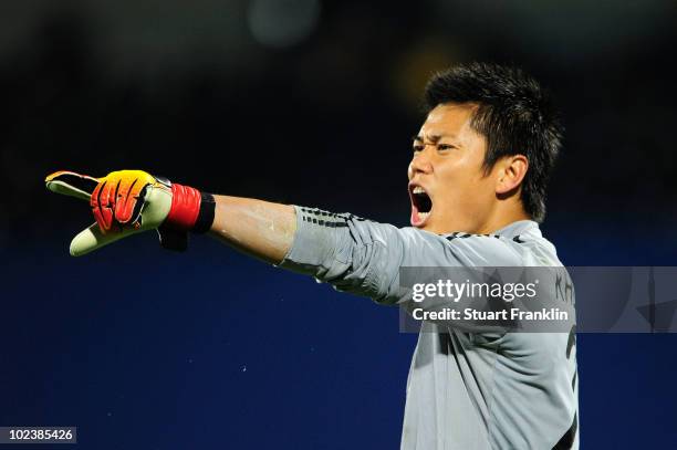 Eiji Kawashima of Japan directs his defence during the 2010 FIFA World Cup South Africa Group E match between Denmark and Japan at the Royal Bafokeng...