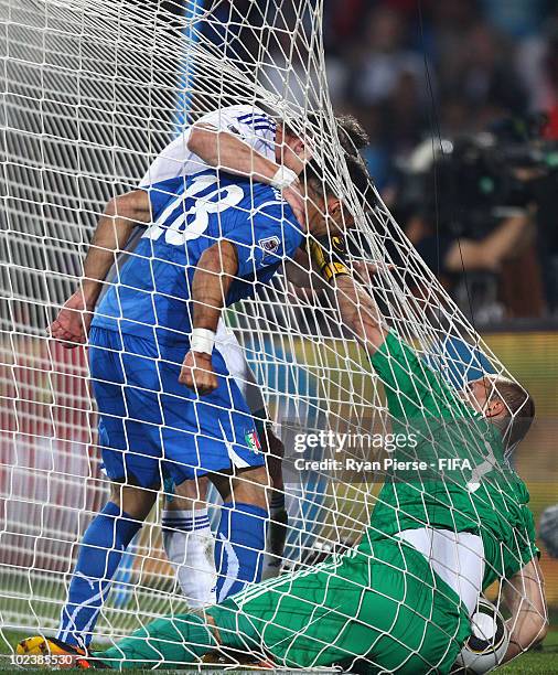 Fabio Quagliarella of Italy tussles with Juraj Kucka of Slovakia and goalkeeper Jan Mucha of Slovakia during the 2010 FIFA World Cup South Africa...