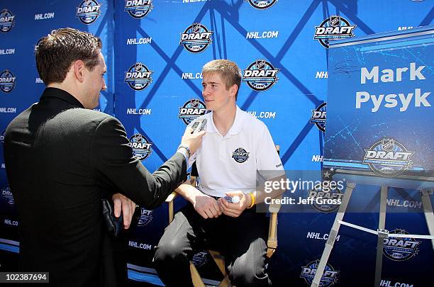 Mark Pysyk is interviewed by a member of the media during NHL top prospect media availibilty prior to the start of the 2010 NHL Draft outside Staples...