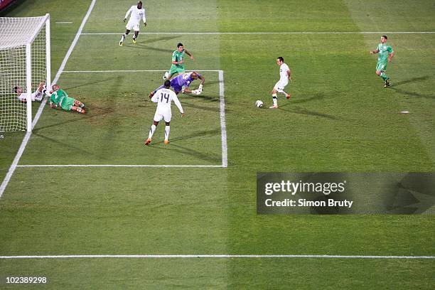 World Cup: USA Landon Donovan in action, game-winning goal during 91st minute vs Algeria goalie Rais Bolhi during Group C - Match 38 at Loftus...