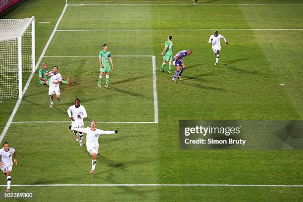 World Cup: USA Landon Donovan victorious after game-winning goal during 91st minute vs Algeria goalie Rais Bolhi during Group C - Match 38 at Loftus...