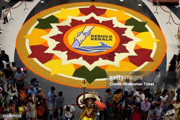 27ft floral Rangoli created by 800 housewives on the occasion of Onam, and the mall also organised a donation drive to help the flood affected people...