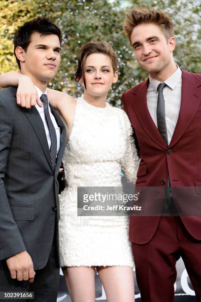 Actor Taylor Lautner, actress Kristen Stewart and actor Robert Pattinson arrive at the premiere of Summit Entertainment's "The Twilight Saga:...