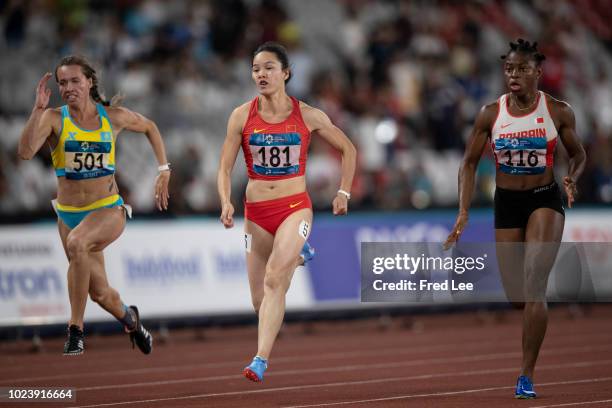 Kazakhstan's Olga Safronova, China's Wei Yongli and Bahrain's Edidiong Odiong compete in the final of the women's 100m athletics event during the...
