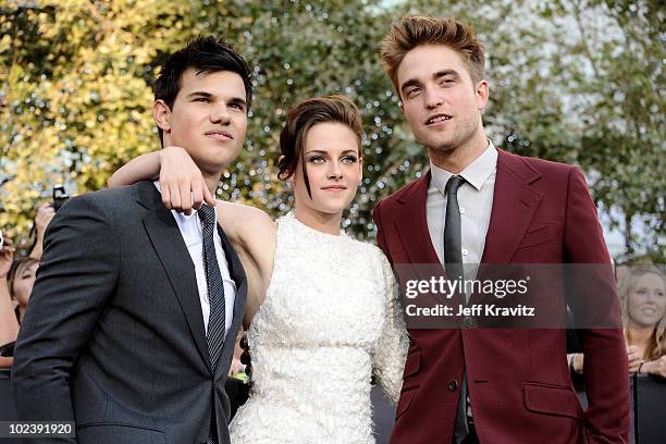 Actor Taylor Lautner, actress Kristen Stewart and actor Robert Pattinson arrive at the premiere of Summit Entertainment's "The Twilight Saga:...